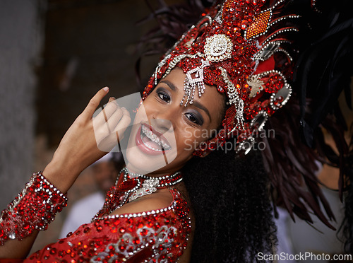 Image of Carnival, dance and woman in portrait for event in Brazil, dancer with gemstone outfit and feather head gear outdoor. Music, samba and happiness for performance and culture with festival and talent