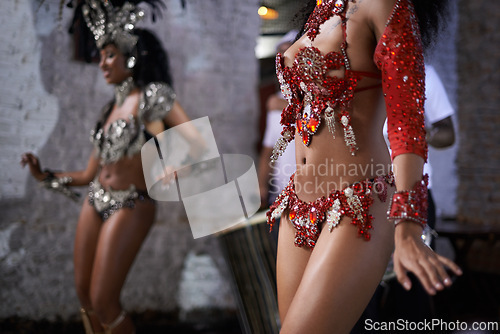 Image of Women, dancer and samba for carnival and music festival or street performance with costume closeup. Body of person dancing with drums for event, tourism and celebration or culture in Rio de Janeiro