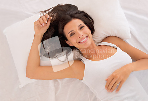 Image of Portrait, morning or top view of happy woman in bed resting in pyjamas to wake up alone in home. Wellness, face or above of excited person on break or pillow with smile, ready to start day or chill