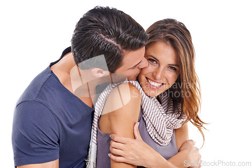 Image of Couple, kiss and happiness in studio with love for romance, bonding and honeymoon date with affection. Marriage, man and woman with hug, care and smile for anniversary commitment on white background