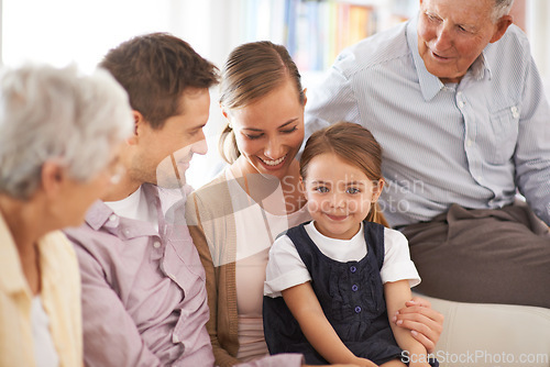 Image of Parents, grandparents or child with portrait on sofa for healthy development, security or comfort in apartment. Family, men or woman with girl kid, happiness or bonding for parenting or love in house