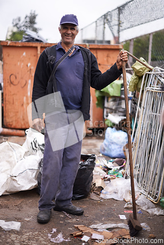 Image of Mature man, broom and sweeping in portrait, hygiene and cleaning for sanitation in dirty outdoor. Male person, street cleaner and equipment for mess, pollution and person for protection of bacteria