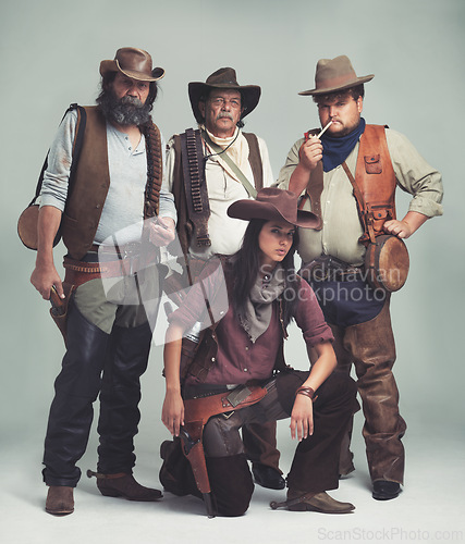 Image of Vintage, western and portrait of cowboy in studio with fashion for halloween, costume and character. Man, woman and group of people with confidence for criminal, band and outlaw lifestyle together