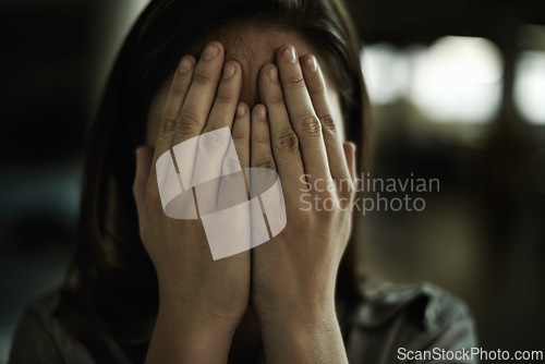 Image of Anxiety, horror and hands on face of woman to cover reaction from fear, panic or terror closeup. Stress, depression and mental health with scared young person hiding from danger, drama or violence