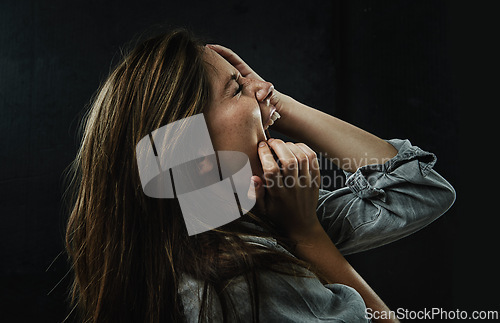 Image of Profile, stress and horror with woman shouting in studio on black background for reaction to fear. Phobia, anxiety and mental health with scared young person screaming in dark for nightmare or terror
