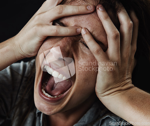 Image of Face, horror and phobia with woman screaming in studio on black background for reaction to fear. Anxiety, mental health and shouting with scared young person in dark for stress, nightmare or terror