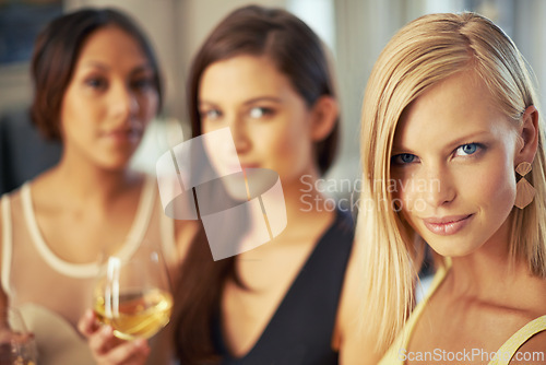 Image of Friends, drink and portrait of woman at night in club, event or party with attitude from alcohol. Wine, glass and relax together for social, bonding or group with cool style and fashion at pub