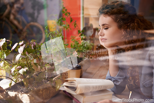 Image of Sleeping, reading and woman with book in cafeteria for knowledge with literature in morning. Diner, student and female person with novel or story drinking coffee, espresso or cappuccino in restaurant