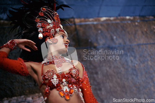 Image of Samba, carnival or happy woman in costume for event, music culture or night celebration in Brazil. Outdoor, performance or proud dancer with smile at festival party, parade or show in Rio de Janeiro