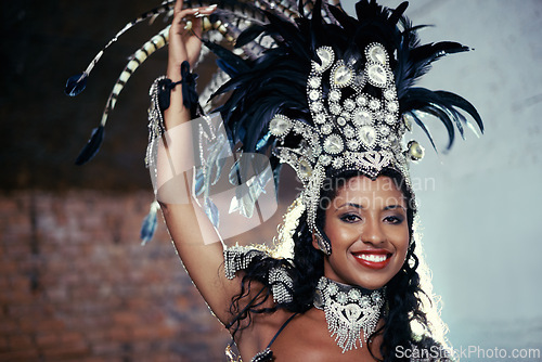 Image of Portrait, samba dancer and black woman with headdress for carnival, festival or parade on urban background in Rio de Janeiro. Brazilian performer, female person and closeup in costume for performance