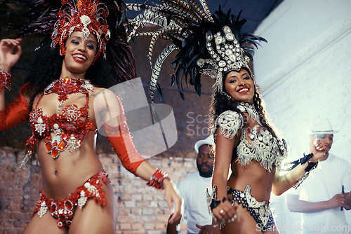 Image of Portrait, carnival or women in costume dancing for celebration, music culture or samba in Brazil. Girl friends, night or dancers with rhythm or fashion at festival, parade or show in Rio de Janeiro