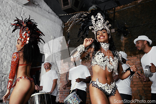 Image of Performance, dance and happy women at carnival in costume for celebration, music culture and band in Brazil. Samba, party and girl friends together at festival, parade or stage show in Rio de Janeiro