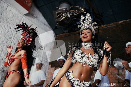 Image of Fun, dance and women at carnival in costume for celebration, music culture and happy band in Brazil. Samba, party and girl friends together at festival, parade or stage performance in Rio de Janeiro