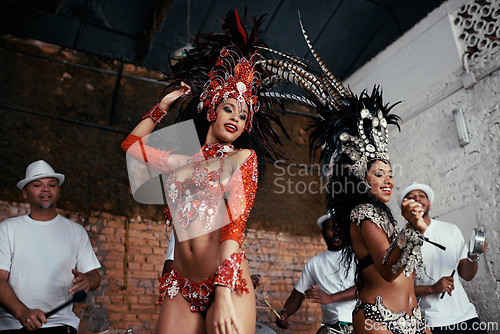 Image of Performance, samba and women at carnival in costume for celebration, music culture and happy band in Brazil. Dance, party and girl friends together at festival, parade or stage show in Rio de Janeiro