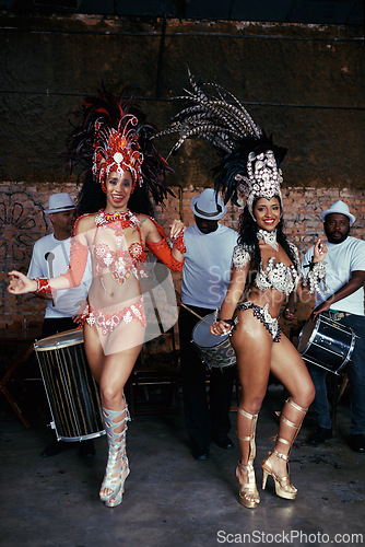 Image of Portrait, samba and women at carnival in costume for celebration, music culture and happy band in Brazil. Dance, party and girl friends together at festival, parade or stage show in Rio de Janeiro