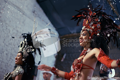 Image of Night, carnival or women in costume dancing for celebration, music culture or samba in Brazil. Girl friends, party or dancers with rhythm or fashion at festival, parade or show in Rio de Janeiro