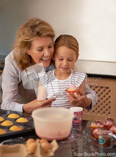 Image of Grandmother, child and baking cupcake in kitchen or helping with decoration or creative icing, sprinkles or teamwork. Female person, girl and youth learning at home or ingredients, recipe or dessert