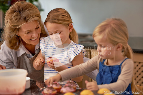 Image of Grandmother, children and baking cupcake or teaching with icing decorations or learning creativity, bonding or teamwork. Woman, siblings and sweet dessert or helping with ingredients, snack or fun