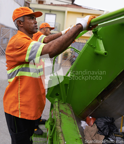 Image of Garbage, worker and man in city with trash, maintenance and waste management service. Urban, cleaning and person with sanitation, industrial truck and collection of rubbish for infrastructure