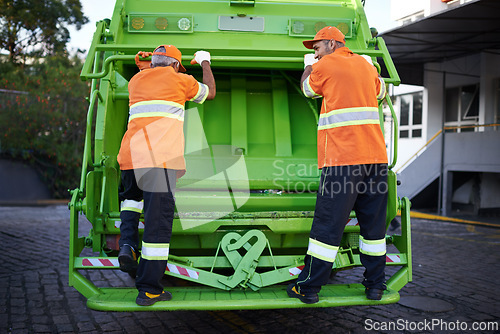 Image of Worker, garbage truck and collection service on street or public environment with teamwork or junk, recycling or waste management. Uniform, maintenance and New York dirt, transportation or sanitation