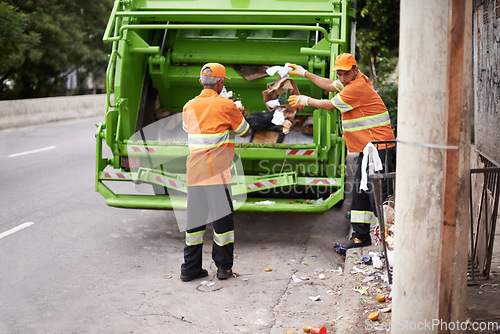 Image of Men, garbage truck and city sidewalk for collection service for public pollution for recycling, waste management or trash. Community worker, teamwork and plastic in New York for junk, refuse or dirt