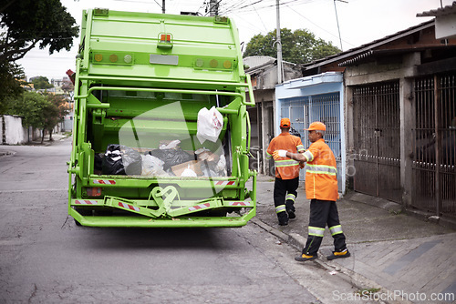 Image of Garbage truck, dirt and people with collection service on street in city for public environment cleaning. Junk, recycling and men working with waste or trash for road sanitation with transport.