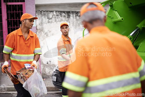 Image of Men, garbage truck and worker in group on street for cleaning, public service and recycling for ecology. People, team and employees of government with vehicle, trash and stop pollution in Cape Town