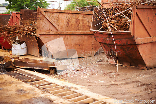 Image of Recycle, scrap and rust on skip in junkyard for sorting, garbage and metal reuse at landfill site. Steel, iron and industrial bin for truck transport with urban pollution at waste dump with machine