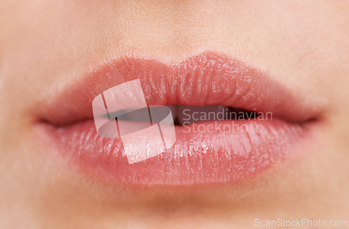 Image of Beauty, macro and lips of woman, cosmetic and lipstick for face or makeup. Skincare, natural or close up of female person, open mouth and aesthetic with lip gloss for cosmetology or facial treatment
