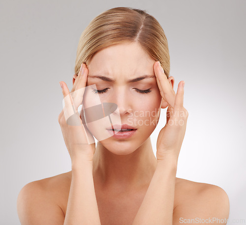 Image of Sick, headache and woman in studio, pain and hands on temple for massage, health and migraine. Beauty, female person and girl with stress from grooming, cosmetology and results for treatment on face