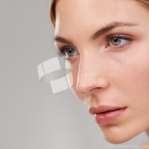 Image of Beauty, cosmetics and face of woman with skincare, natural glow and anti aging facial in studio mockup. Dermatology, healthy skin and girl on grey background with luxury care, thinking and wellness