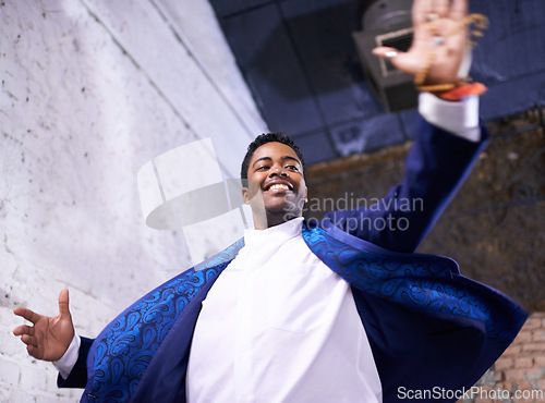 Image of Happy, dance and black man at club with music, energy and movement in celebration at night. African, person and expression of creativity, rhythm and joy from show of talent for salsa choreography