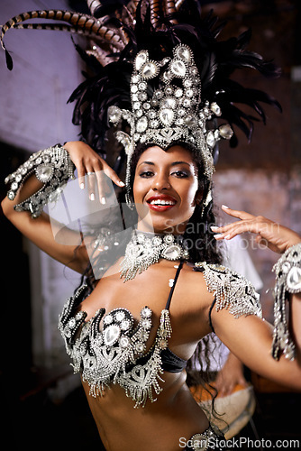 Image of Dancer, carnival and woman in portrait with confidence, pride and culture in concert for music performance in night. Person, girl and stage at event, party and smile at celebration in Rio de Janeiro