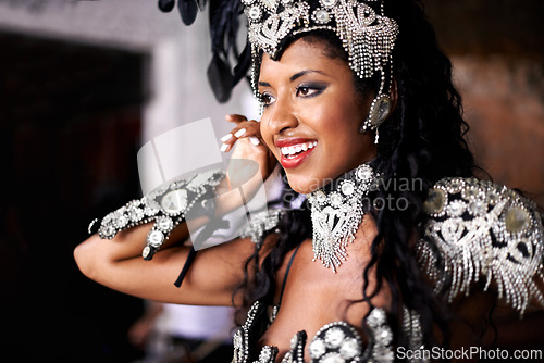 Image of Dancer, carnival and woman with performance, happy and pride for culture on stage, music and band in night. Girl, smile and people dancing at event, party or celebration for history in Rio de Janeiro