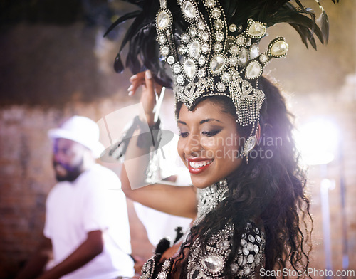 Image of Dancer, carnival and girl with performance, band or pride for culture in group, music or concert in night. Woman, smile and people dancing at event, party or celebration for show in Rio de Janeiro