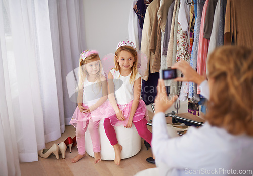 Image of Children, fairy and costume with cellphone picture or social media post for dress up event, connection or memory. Girls, crowns and smile for smartphone photography for online network, fun or bonding