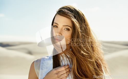 Image of Portrait, desert and woman with holiday, sunshine and weekend break with long hair on getaway trip. Face, person and girl with vacation and summer with wind and outdoor with nature or relaxing