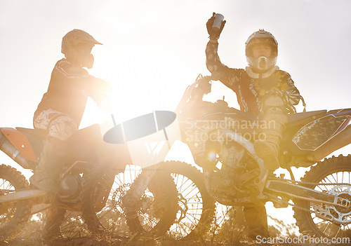 Image of Sport, racer or people on motorcycle outdoor on dirt road and relax after driving, challenge or competition. Lens flare, motorbike or dirtbike driver and sunrise on offroad course or path for racing