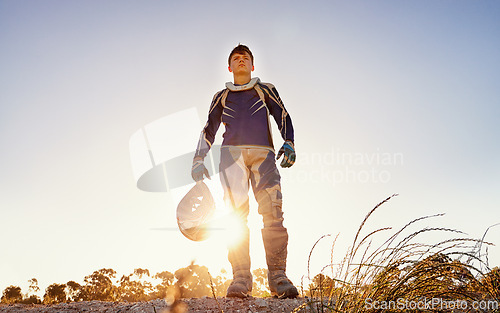 Image of Man, motocross and rider of extreme sport in nature, confident and danger for adrenaline adventure with speed. Athlete, pride or gear for motorcycle action off road or skill in driving a fast vehicle