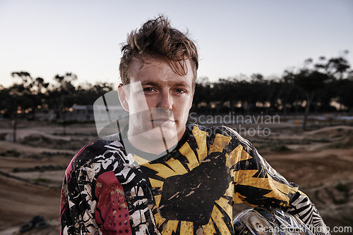 Image of Sports, dirt and portrait of man biker on offroad in gear for race, challenge or competition. Serious, adventure and face of male athlete motorcyclist with mud at action motorcross rally outdoor.