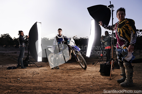 Image of Photoshoot, motorcycle and person in nature with lighting, equipment and tools for creative project. Gear, group of people and helmet for extreme sport production and photography on off road track.