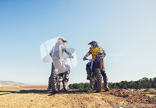 Image of Rear view, sport or people on motorcycle outdoor on dirt road with relax after driving, challenge and competition. Sports, motorbike and dirtbike driver with helmet on offroad and path for racing