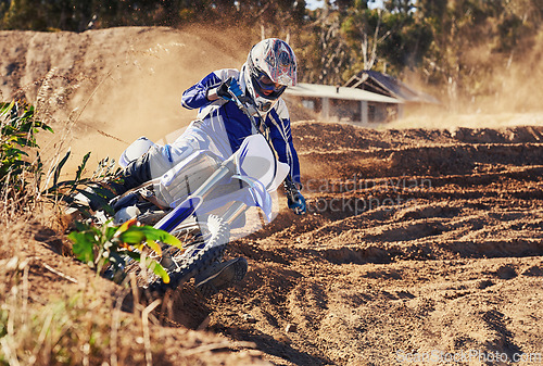 Image of Person, dirt bike and professional motorcyclist in extreme sports, competition or race on outdoor track. Expert rider on motorbike or scrambler for sand course, challenge or off road rally in nature