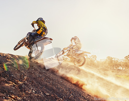 Image of Hill, racer and motorcycle in action for competition on dirt road with performance, challenge and adventure. Motocross, motorbike and dirtbike driver with stunt on offroad course and path for racing