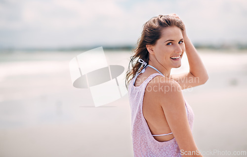 Image of Happy woman, portrait and beach for summer vacation, holiday or tropical weekend in nature. Face of young female person with smile for fun travel, walk or enjoying outdoor day by the ocean coast