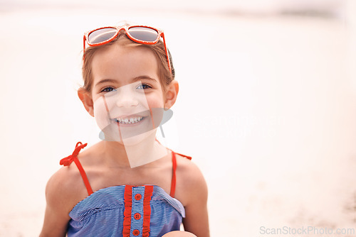 Image of Happy, portrait and little girl with fashion at the beach for fun holiday, weekend or summer on mockup space. Face of person, child or kid with smile in happiness for day by the sandy shore in nature