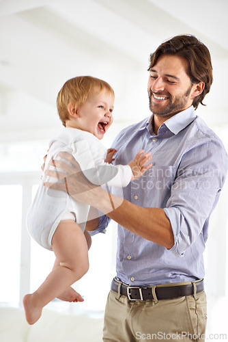 Image of Dad, baby and laughing while playing, bonding and love at home for child development and growth. Father, parent and infant for fun, cheerful and family at house after work and getting kid to sleep