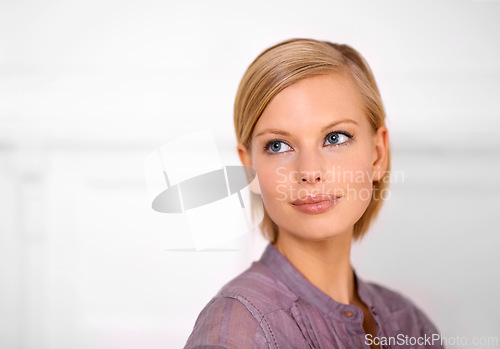 Image of Beauty model, woman and makeup on face for skincare, confidence and elegant in white background. Female, thinking and idea in backdrop with smile, cosmetics and mockup space in isolated studio