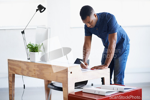 Image of Business, graphic designer and black man with planning, writing and brainstorming for a project. African person, entrepreneur and creative with PR agency and deadline with startup or idea development