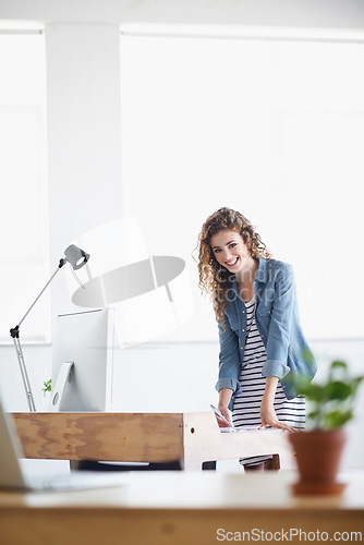 Image of Woman, portrait and writing or planning at office desk for creative, project and startup in architecture or design. Young designer or worker with creative notes for business, floor plan and computer